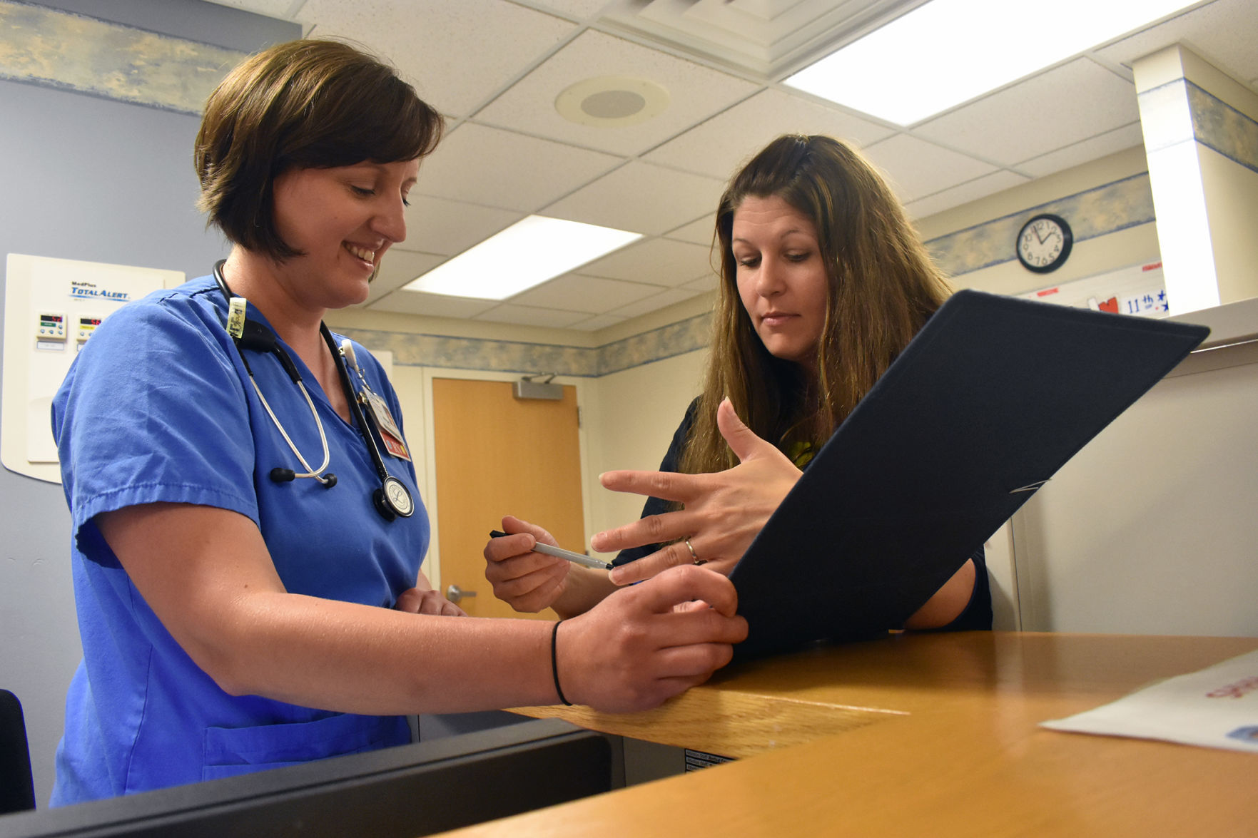 Registered nurses review files